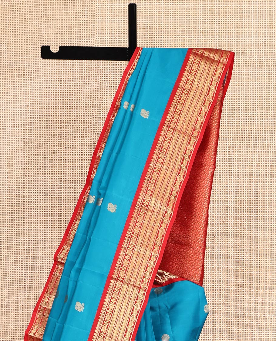 Blue Vasundhara Lite-Silk Mix Saree, Decked Up with Mayil-Chakram Buttas, Contrast Border of Thilakam Mokku, Banaras, and Vanki Design, Jaal Pallu, and a Contrast Blouse