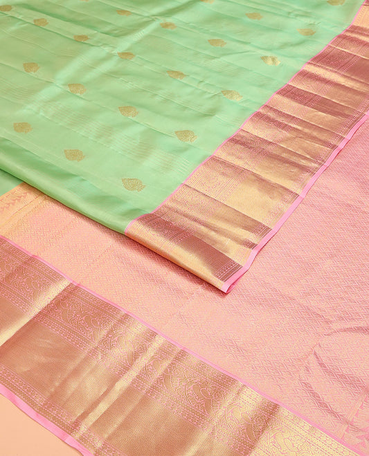 Green Vasundhara Lite Silk Mix Saree, Mesmerized with Stripes, and Zari Buttas, Complemented by a Contrast Border of Manga, Diamond, Mayil, and Mayil Kann Designs, Pallu of Jaal Designs, and Paired with a Contrast Blouse