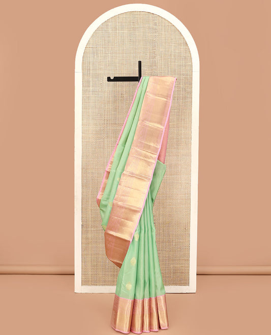 Green Vasundhara Lite Silk Mix Saree, Mesmerized with Stripes, and Zari Buttas, Complemented by a Contrast Border of Manga, Diamond, Mayil, and Mayil Kann Designs, Pallu of Jaal Designs, and Paired with a Contrast Blouse