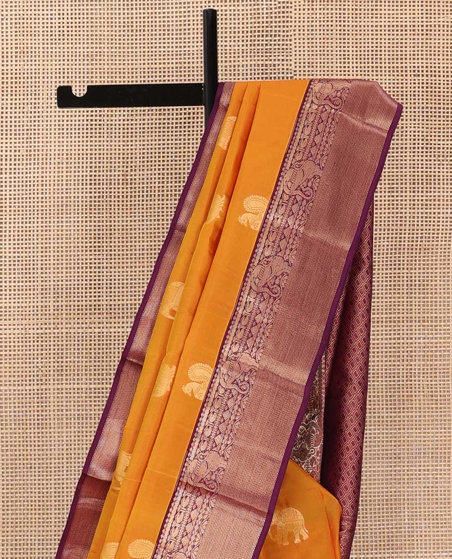 Yellow mayil and yaanai buttas silk saree, contrast border of thilakam mokku, neli, manga and yaali designs and jaal pallu