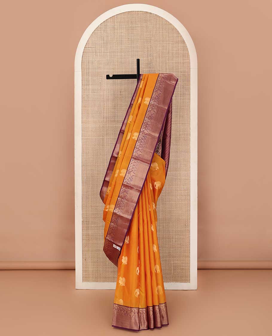 Yellow mayil and yaanai buttas silk saree, contrast border of thilakam mokku, neli, manga and yaali designs and jaal pallu