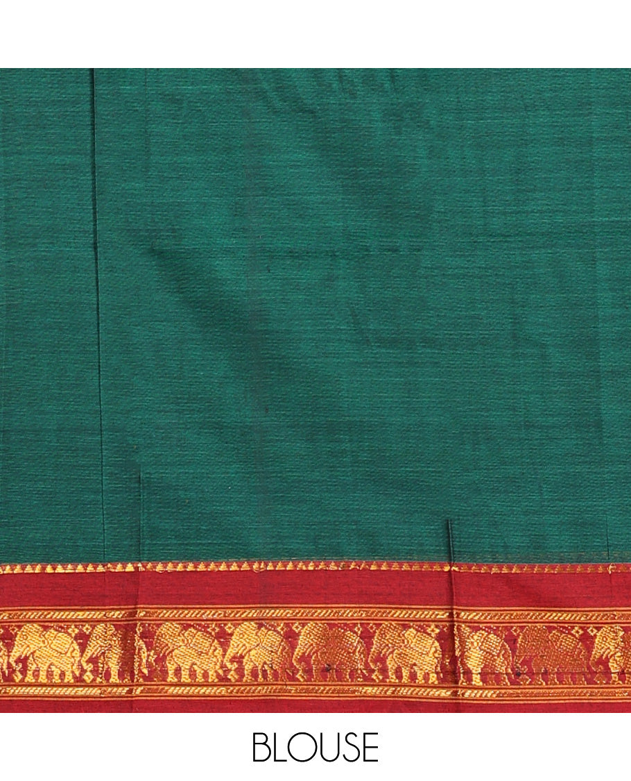 Green cotton half-saree, plain with contrast elephant motif bordered skirt, matching blouse, and contrast elephant motif bordered dhavani