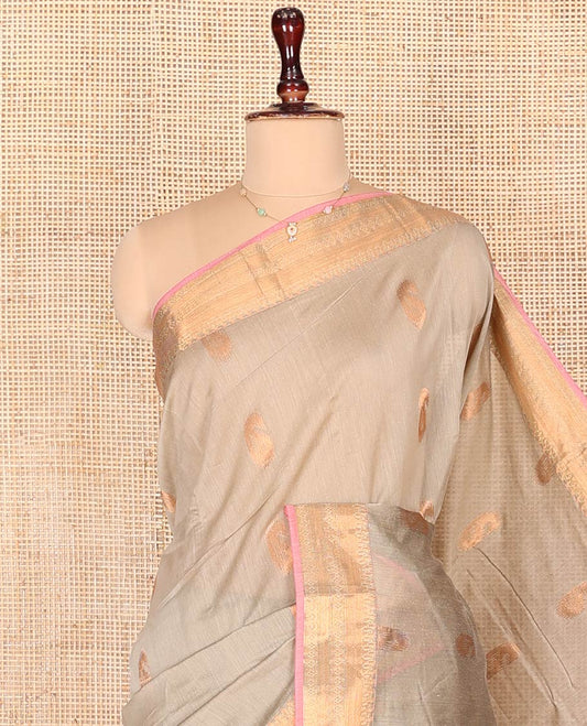 Grey Semi-Silk Cotton Saree, Embellished with Paisley Zari Buttas on Its Body, Highlighted by a Traditional Zari Design Border, Captivating Contrast Pallu of Floral Designs, and Paired with a Contrast Blouse