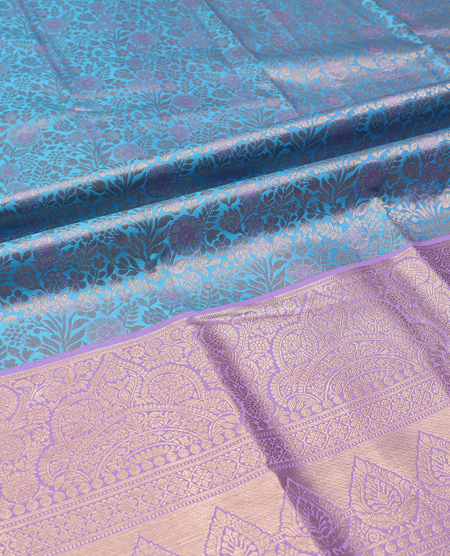 Green pure-silk half-saree, jacquard skirt, contrast blouse, and border of Mughal-style zari designs, and intricate dhavani