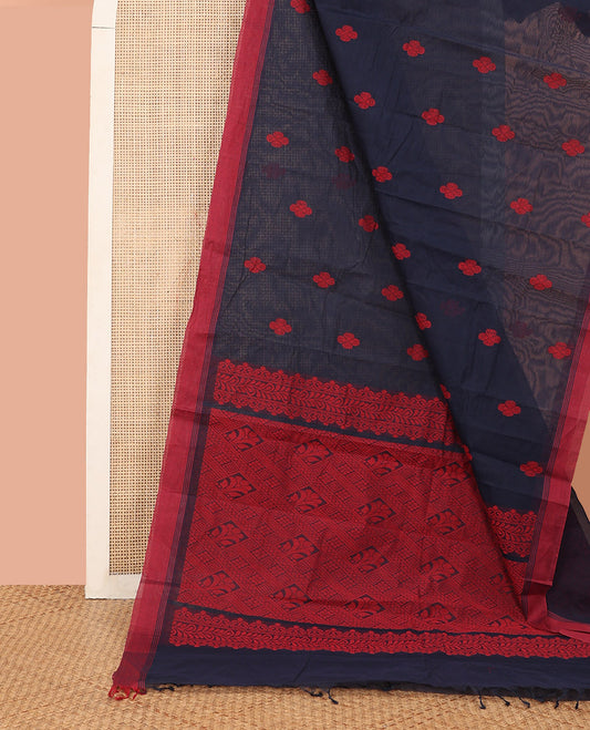 Navy Blue Kanchi Cotton Saree, Accentuated with Flower Buttas All Over Its Body, Complemented by a Contrast Border, Pallu Showcasing Jaal Designs, and Paired with a Matching Blouse