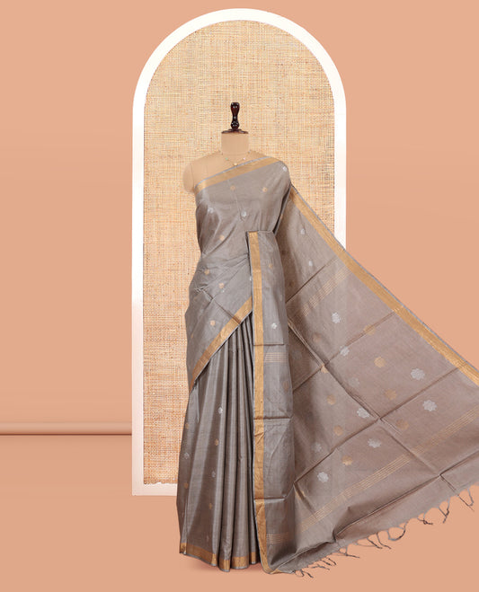 Grey Tussar Saree Subtly Sparkled with Buttas, a Subtle Zari Border, Pallu of Zari Designs, and a Matching Blouse