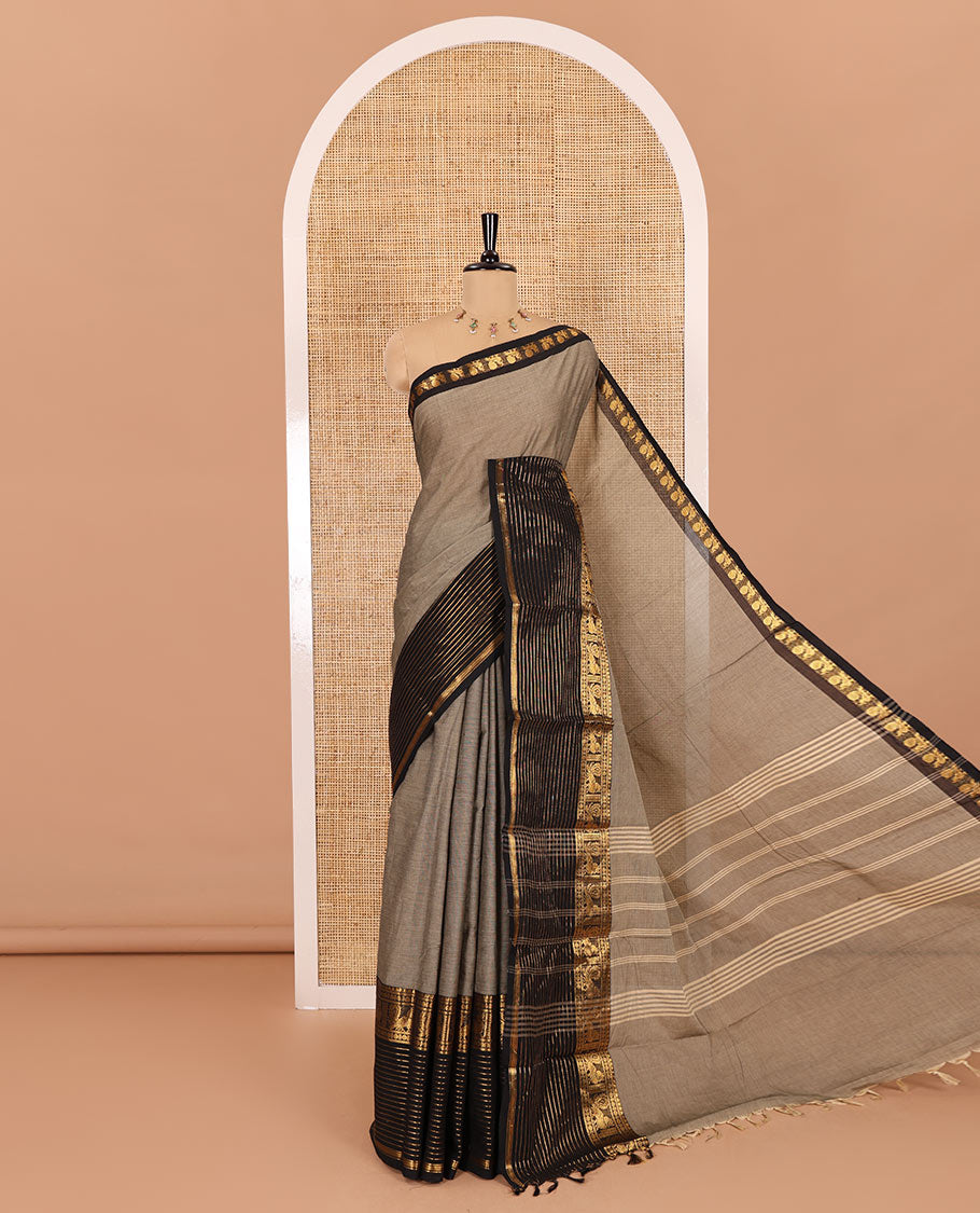 Grey plain chettinad cotton saree, contrast traditional zari border of peacock motifs, striped pallu, and a matching blouse