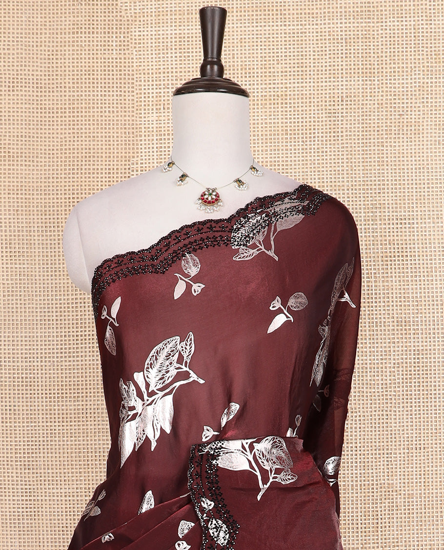 Maroon leaf motifs foil printed designer saree, scallop black micro-stone work border