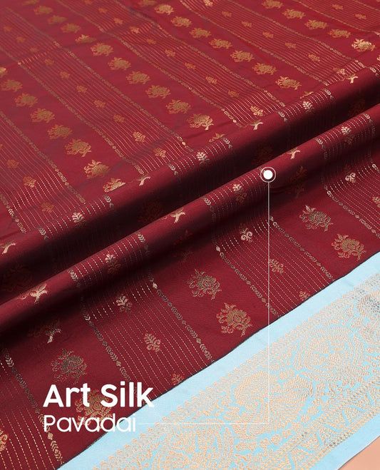 Maroon Art Silk Pavadai Material Set, Prettified with Buttas and Stripes on Its Skirt, Complemented by a Contrast Traditional Zari Design Border, and Paired with a Contrast Blouse