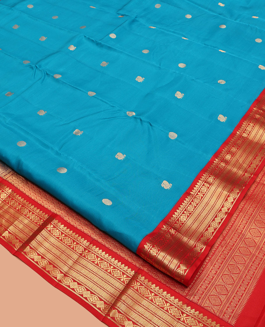 Blue Vasundhara Lite-Silk Mix Saree, Decked Up with Mayil-Chakram Buttas, Contrast Border of Thilakam Mokku, Banaras, and Vanki Design, Jaal Pallu, and a Contrast Blouse