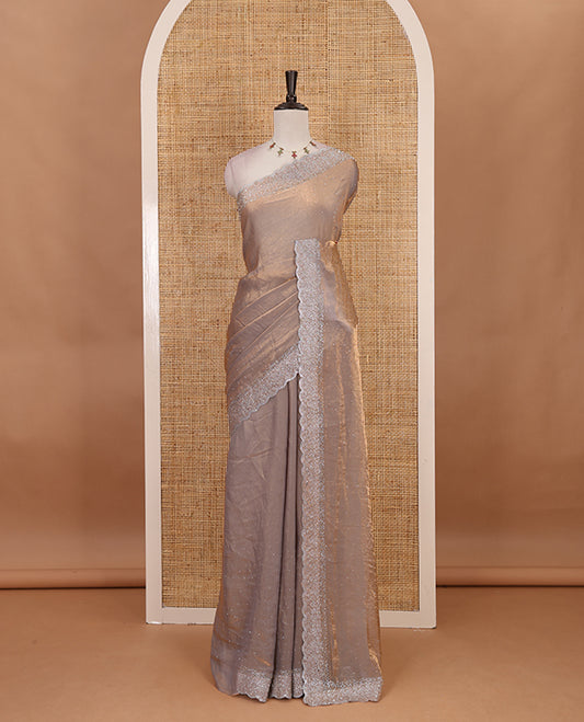 Grey Swarovski crystal stone embedded fendy chiffon saree, scallop Swarovski stone embroidered border, and contrast plain blouse