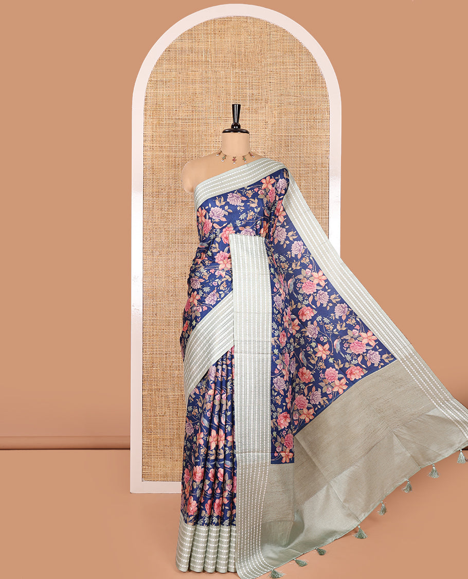 Royal blue colorful floral motifs printed fancy tussar saree, contrast triangle motifs border, striped pallu, and a contrast striped blouse