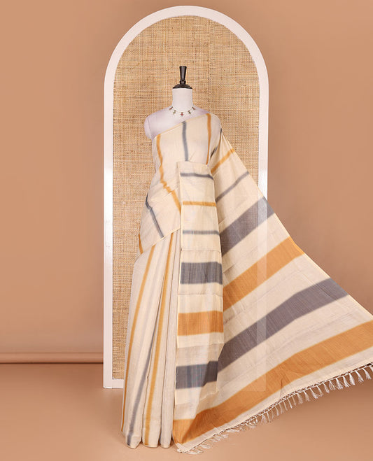 Borderless cream, colorful striped tissue saree, unique motifs printed mustard color blouse