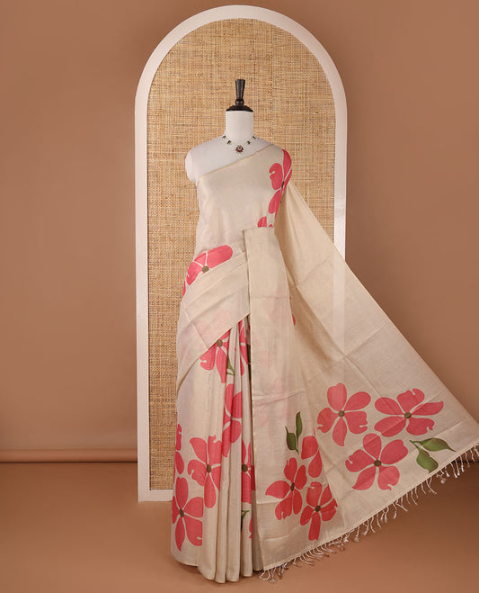 Borderless cream printed onam tissue silk saree features pink color five-petal flower & leaf motifs print, matching floral print blouse