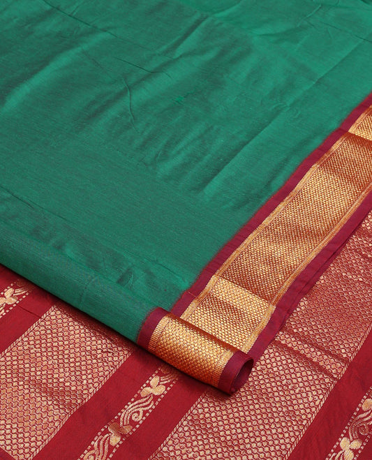 Green plain nine-yard cotton saree, contrast traditional zari border, and pallu of traditional designs