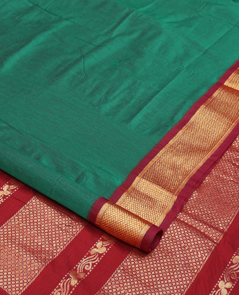 Green plain nine-yard cotton saree, contrast traditional zari border, and pallu of traditional designs