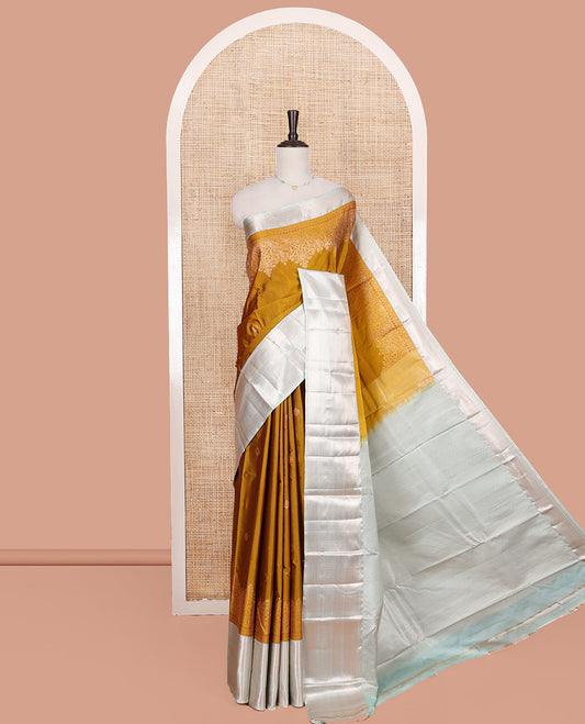 Mustrad Budget Silk Saree, Dazzled with Zari Buttas All Over Its Body, Complemented by a Contrast Traditional Zari Design Border, Intricately Zari Decorated Pallu, and Paired with a Contrast Blouse