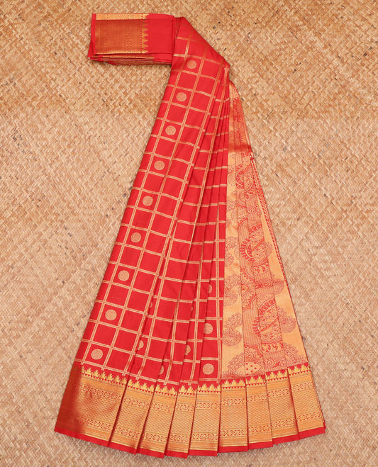 Red Budget Silk Saree, Detailed with Peacock-Chakram Butta Enclosed Checks All Over Its Body, Highlighted by a Temple Zari Border of Traditional Designs, Pallu Depicts Mughal-Style Intricate Designs, and Paired with a Matching Blouse