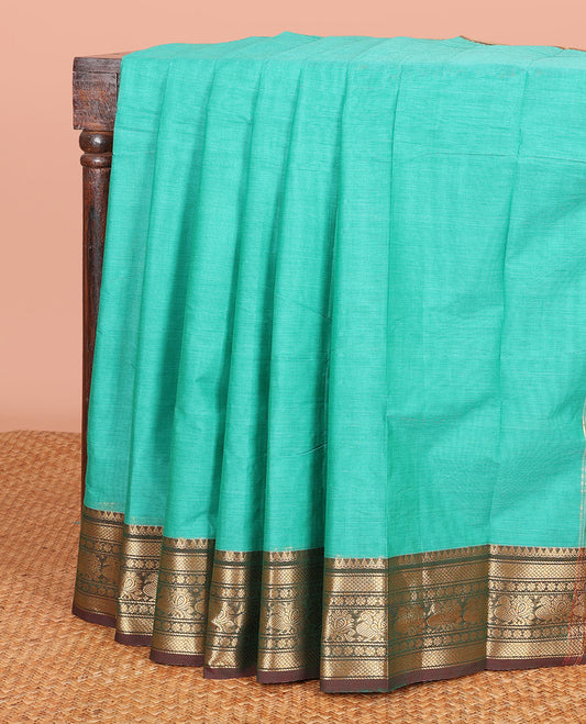 Green Plain Chettinad Cotton Saree, Complemented by a Contrast Traditional Zari Design Woven Border, and a Pallu of Zari Stripes