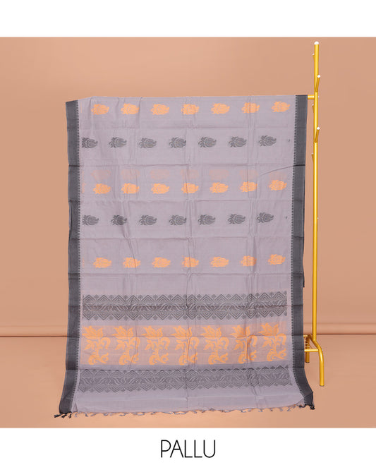 Grey Kanchi Cotton Saree, Decked Up with Buttas All Over Its Body, Complemented by a Contrast Border, Pallu of Floral and Geometric Designs, and Paired with a Matching Blouse