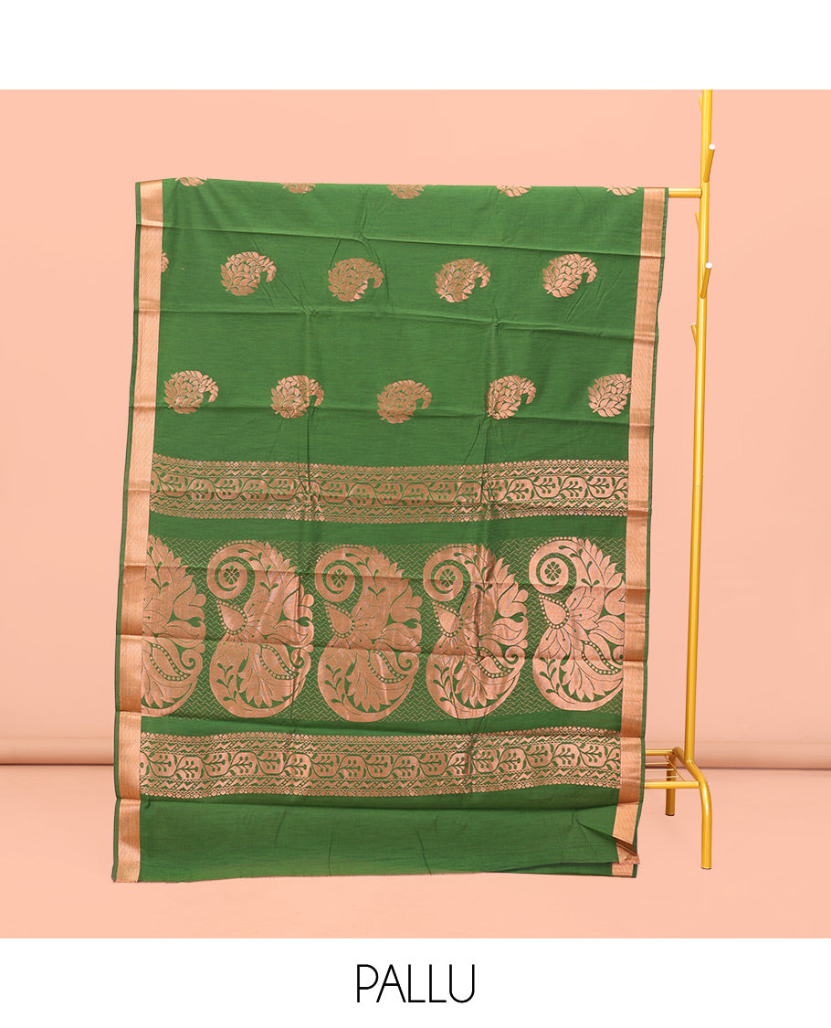 Green Semi-Silk Cotton Saree, Masterfully Woven with Paisley Zari Buttas All Over Its Body, Highlighted by a Zari Border, Pallu of Floral and Paisley Design, and Paired with a Matching Blouse