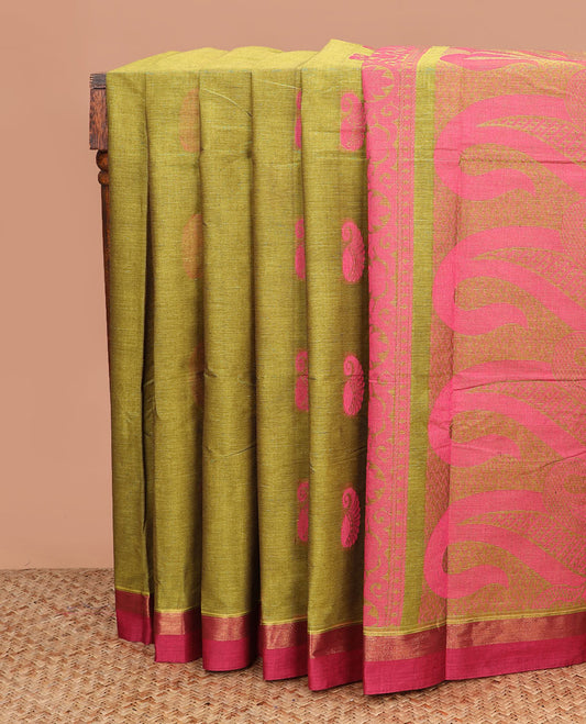 Green buttas kanchi cotton saree, contrast border, and pallu of floral creeper, and paisley designs