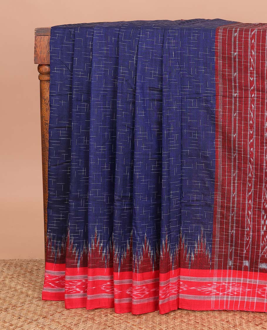 Navy blue geometric maze style ikkat cotton saree, contrast red ikkat border, and pallu of ikkat weave