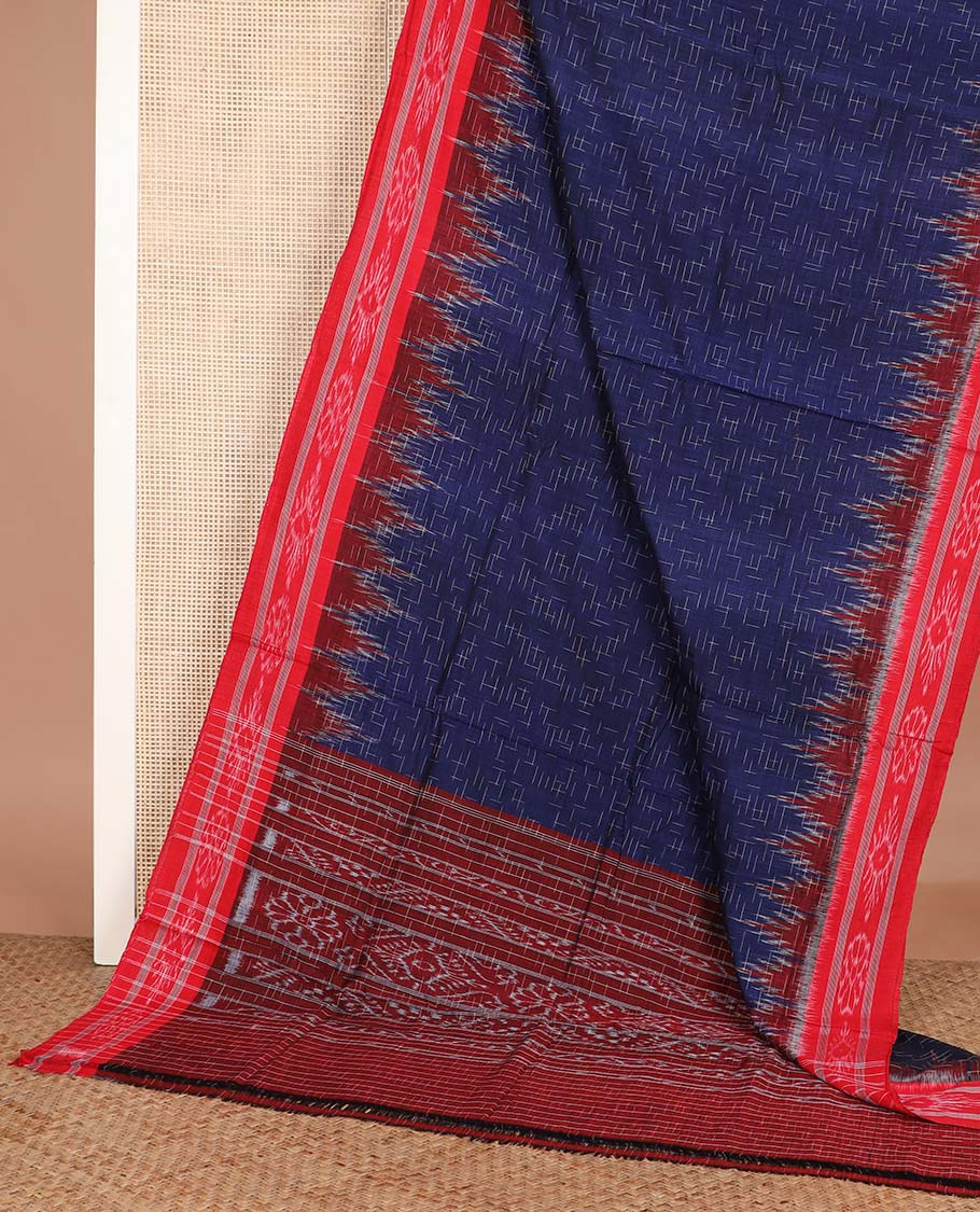 Navy blue geometric maze style ikkat cotton saree, contrast red ikkat border, and pallu of ikkat weave