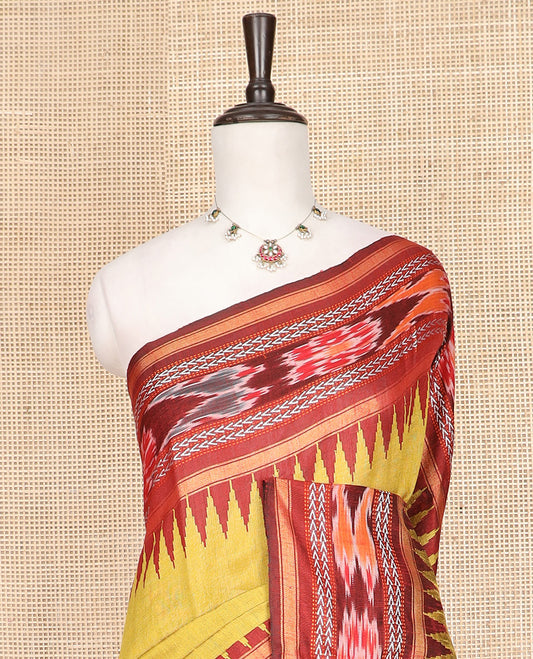 Yellow Plain Dupion Silk Saree, Captivated by a Contrast Temple Border of Geometric Patterns and Ikkat Weave, Pallu Depicting Floral Ikkat Designs, and Paired with a Contrast Blouse
