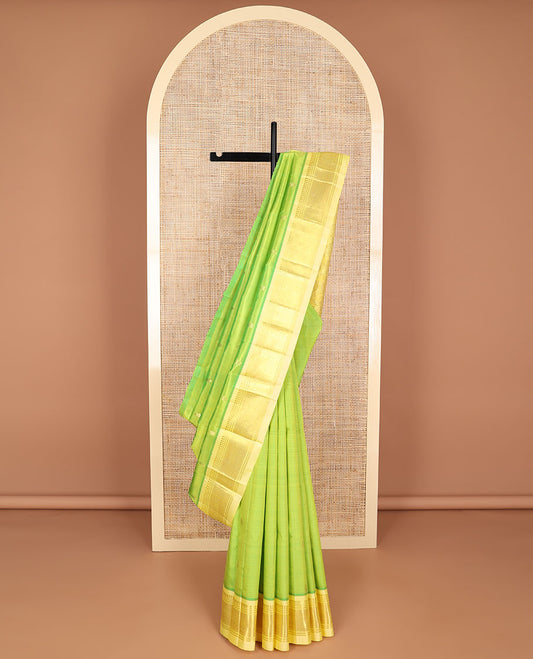 Light green floral buttas kancheepuram silk saree with contrast zari designb order & floral striped design pallu