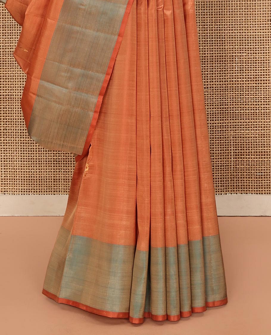 Orange Kanchipuram Silk Saree, Adorned with Zari Buttas All Over Its Body, Complemented by a Contrast  Border of Manga Designs, Pallu of Manga Designs, and Paired with a Contrast Blouse