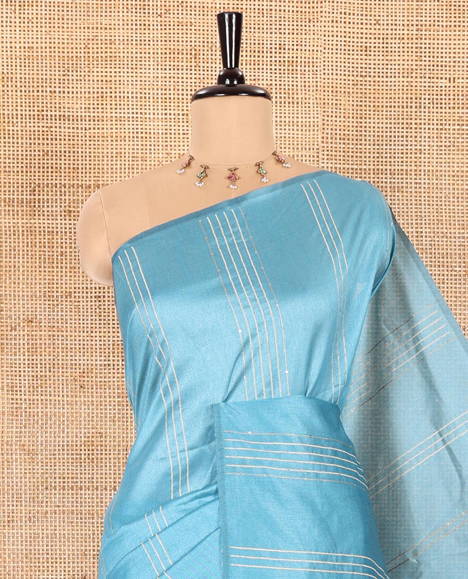 Borderless Blue Semi-Raw Silk Saree Featuring Elegant Vertical Sequin Stripes Running Across the Body, Complemented by a Contrast Thread-Work Pallu and Paired with a Contrast Blouse