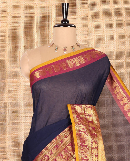 Navy Blue Plain Chettinad Cotton Saree, Complemented by Contrast Traditional Zari Border of Peacock and Elephant Designs, Gleaming Pallu of Stripes, and Paired with a Matching Blouse