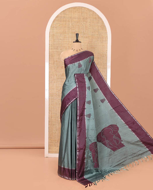 Green Soft Silk Saree, Mesmerized with Elephant Motifs All Over Its Body, Complemented by a Contrast Zari Striped Border, Pallu Depicts Big Elephant Motifs, and Paired with a Matching Blouse