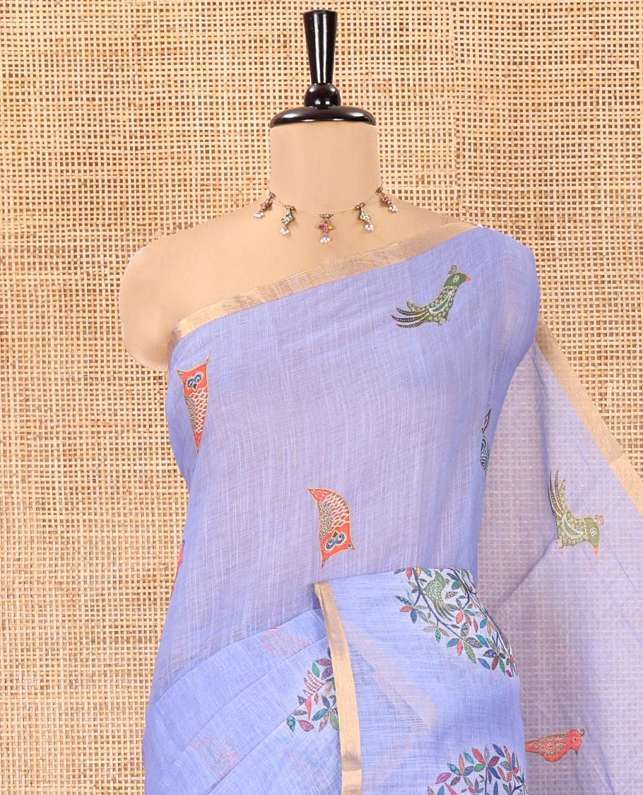 Blue Linen Cotton Saree, Steeped in the Richness of Nature-Themed Motifs Like Bird, Owl, and Tree, a Subtle Piping Border, Pallu of Tree Motifs, and Paired with a Matching Blouse