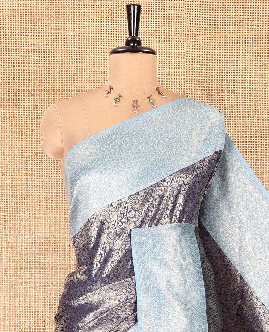 Navy Blue Kanchi Silk Saree, Prettified with Floral Jacquard Design on Its Body, Complemented by a Contrast Traditional Zari Design Border, Sparsely Woven Pallu, and Paired with a Contrast Blouse