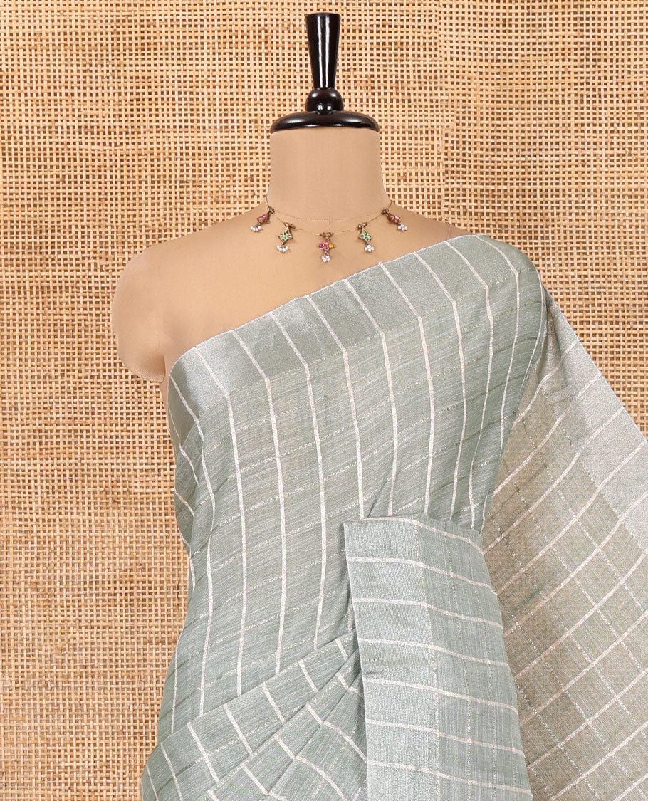 Green Jute Linen Cotton Saree, Adorned with Checked Design on Its Body, a Subtle Self-Border, Striped Pallu, and Paired with a Matching Thread Embroidered Blouse