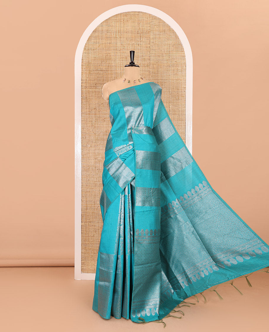 Borderless, blue striped, and zari traditional kanchi motifs fancy tussar saree, intricately zari-woven pallu, and a matching zari buttas woven blouse