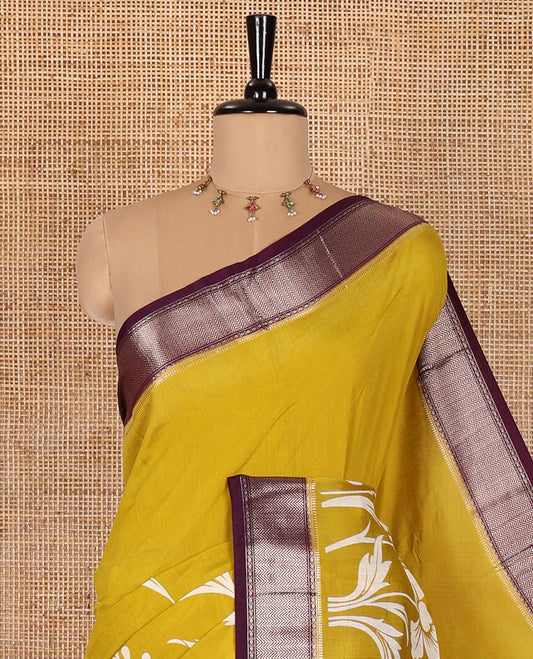 Gold leaf vine discharge printed assam silk saree, contrast chevron design zari border, zari stripes, and a contrast zari bordered blouse