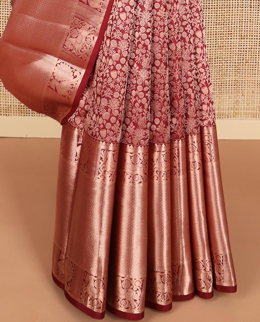 maroon floral jacquard kancheepuram silk saree with self border of thilakam mokku, muthu, banaras, mayil design & zari design pallu