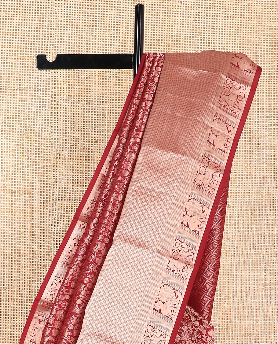 maroon floral jacquard kancheepuram silk saree with self border of thilakam mokku, muthu, banaras, mayil design & zari design pallu
