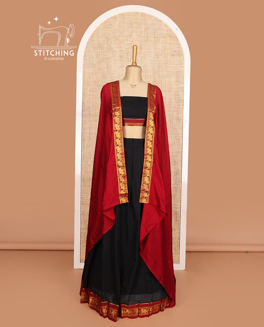 Black cotton half-saree, plain with contrast elephant motif bordered skirt, matching blouse, and contrast elephant motif bordered dhavani