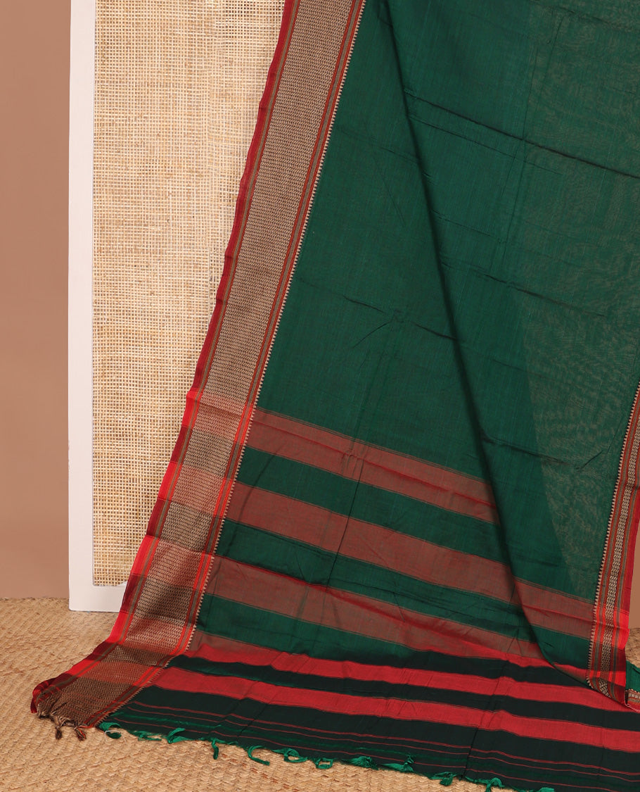 Dark green plain Narayanapet cotton saree, contrast geometric patterned thread border, and striped pallu