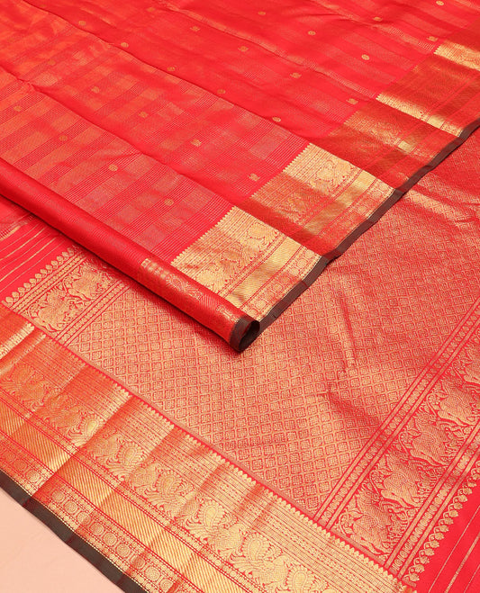 Red zari checked and buttas Kanchipuram silk saree, zari border of thilakam mokku, banaras, kamalam, mayil, and chakram designs, and jaal pallu
