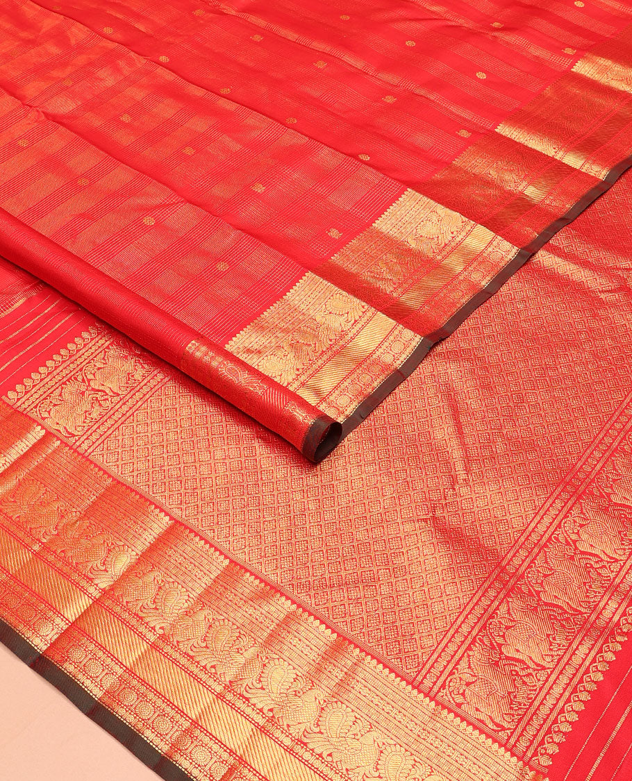 Red zari checked and buttas Kanchipuram silk saree, zari border of thilakam mokku, banaras, kamalam, mayil, and chakram designs, and jaal pallu