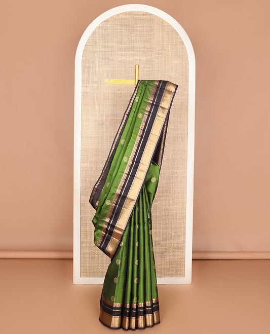 Green chakram zari buttas Vasundhara silk mix saree, contrast rettai pettu border of thilakam,banaras,rudraksham & manga & jaal pallu