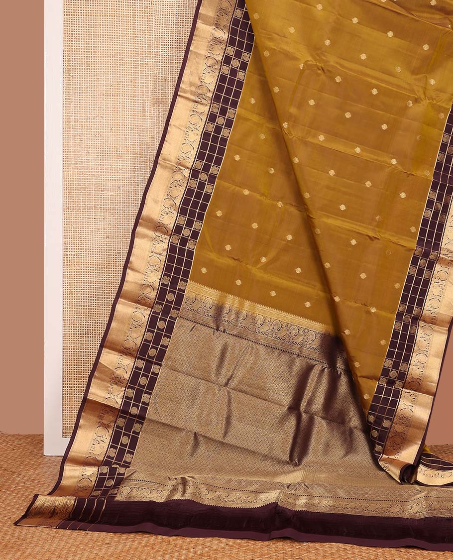 Mustard zari buttas Vasundhara silk mix saree, contrast annam chakram enclosed zari checked border of rekku, kamalam, arumbu manga, and yaanai, and jaal pallu
