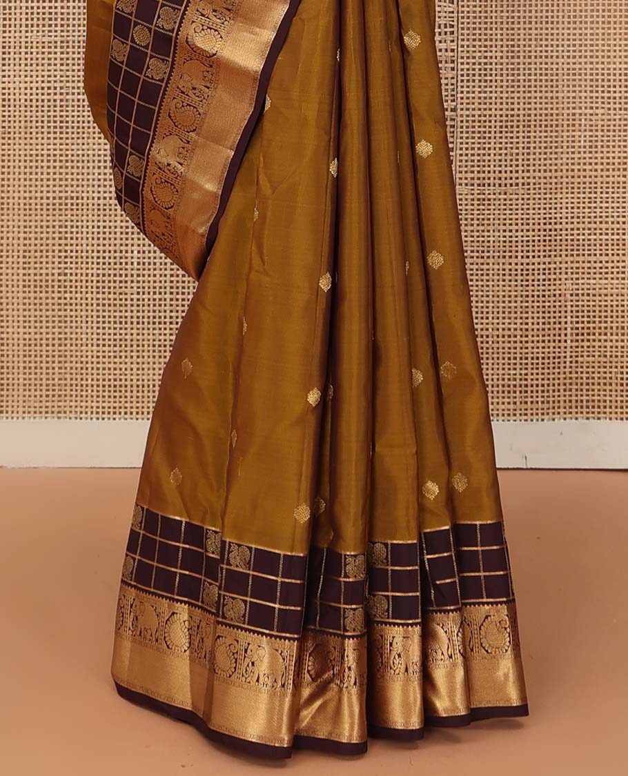 Mustard zari buttas Vasundhara silk mix saree, contrast annam chakram enclosed zari checked border of rekku, kamalam, arumbu manga, and yaanai, and jaal pallu