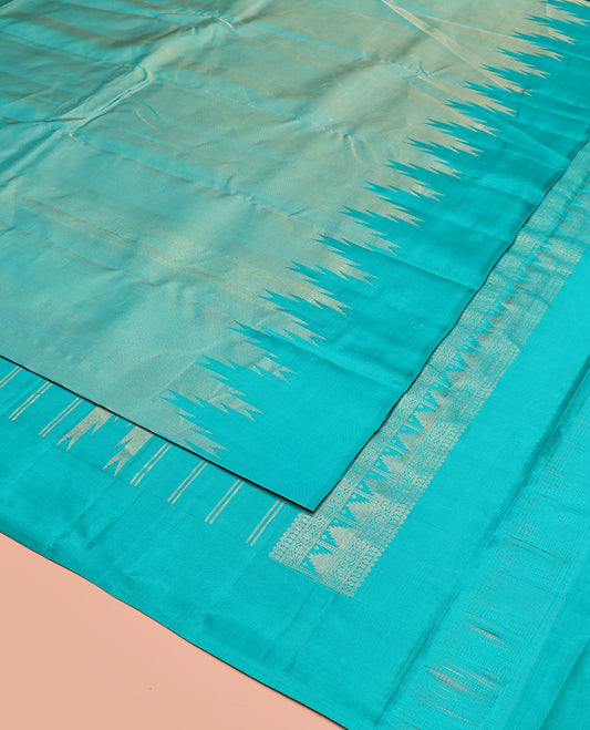 Blue Vasundhara Silk Saree Gleamed Up with Thazampoo Rekku Border, Pallu of Manga, Kodi Visiry, and Thazampoo Rekku Designs, and Paired with a Matching Blouse