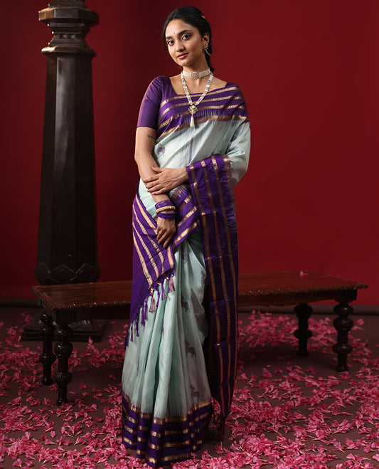 Blue Kanchipuram Silk Saree, Delicately Woven with Deer Buttas All Over Its Body, Complemented by a Contrast Varisai Pettu Border of Muthu, Rudraksham, and Mayil Kann Designs, Grand Jaal Pallu, and Paired with a Contrast Blouse